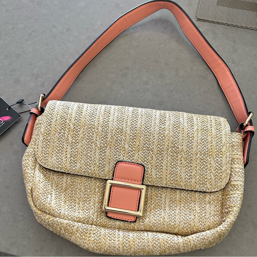 Coral and beige shoulder bag. New with tags 12” x 7” one compartment.
